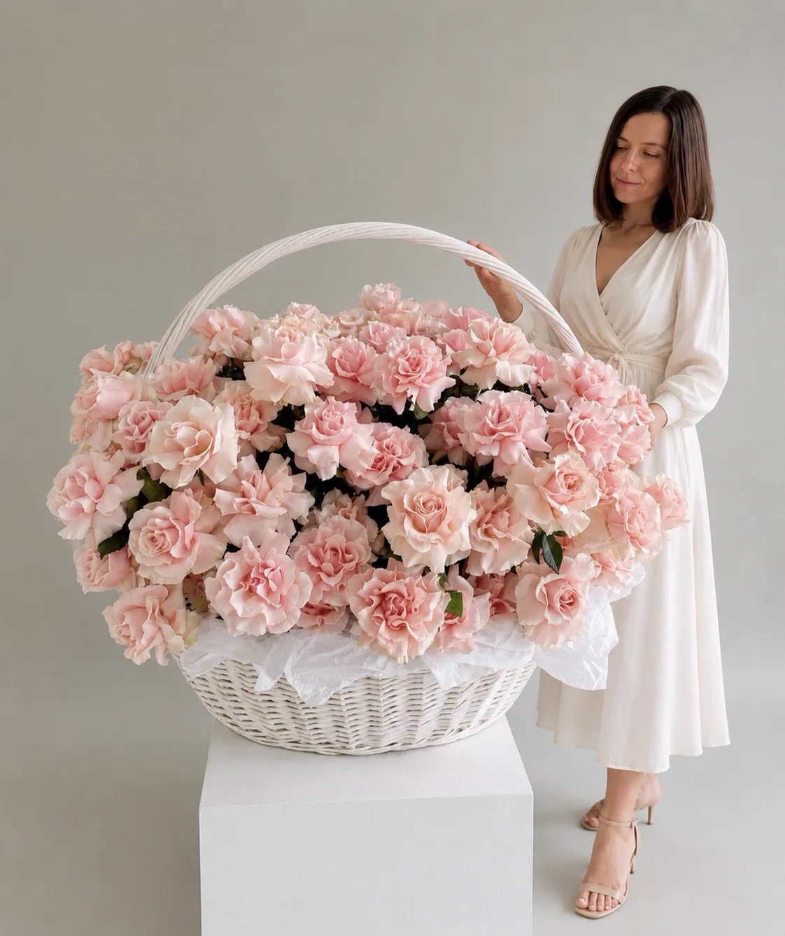 A luxurious, oversized bouquet of mixed peonies and roses displayed in a bright Dubai penthouse.